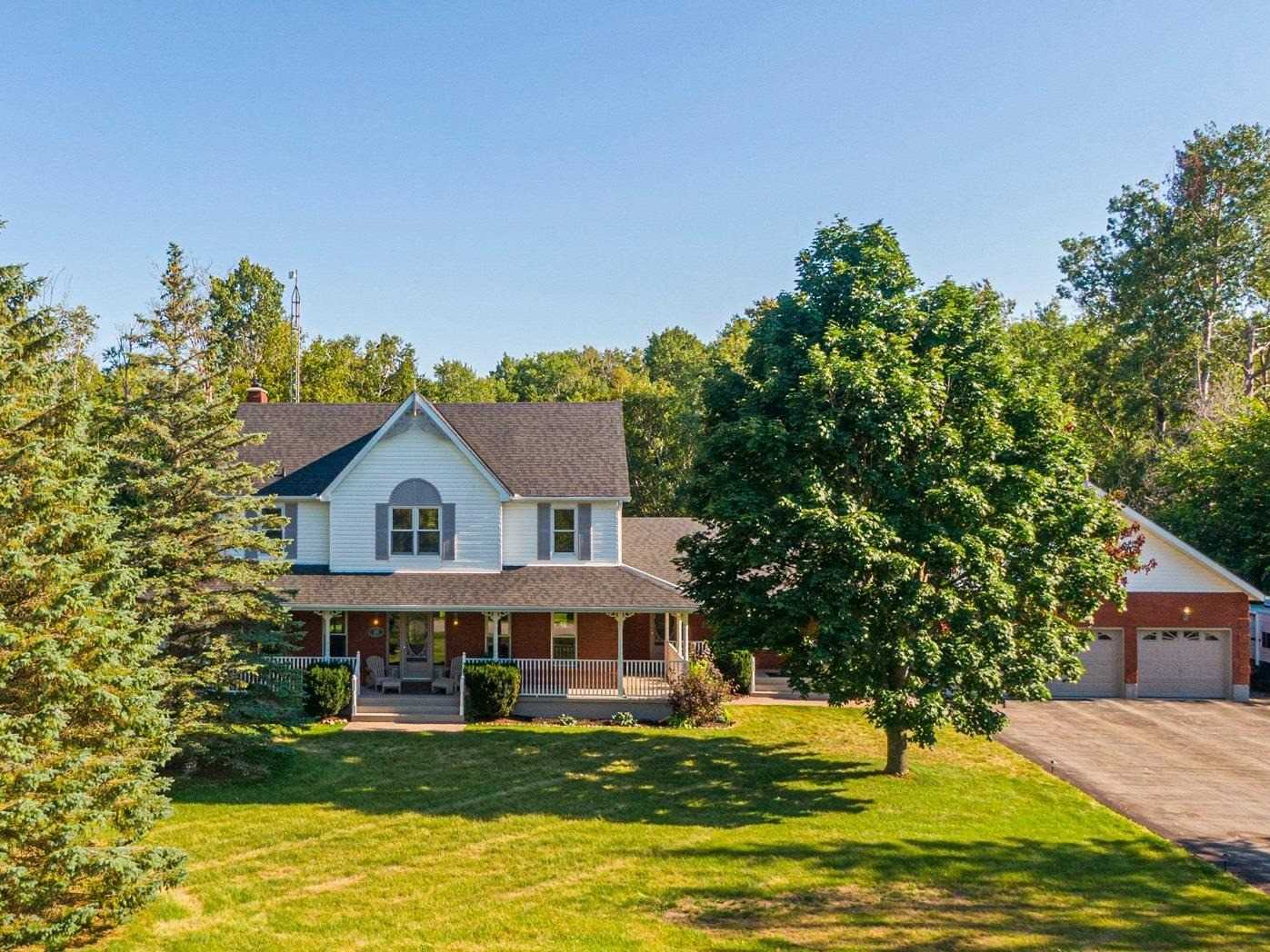 Rural home with a spacious yard and mature trees near Lake Simcoe, Ontario.